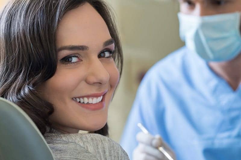 smiling woman at dentist